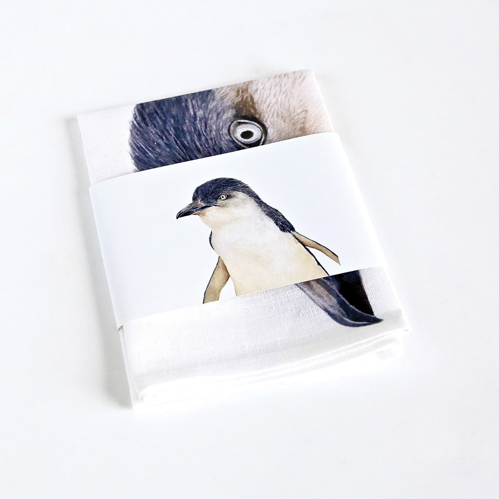 white linen tea towel with little fairy penguin watercolour artwork