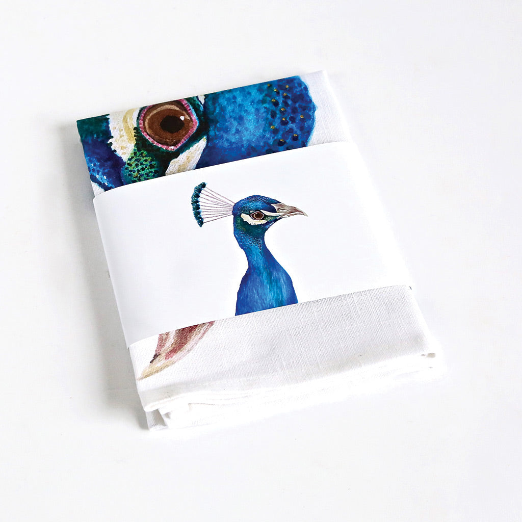 white linen tea towel with peacock watercolour artwork
